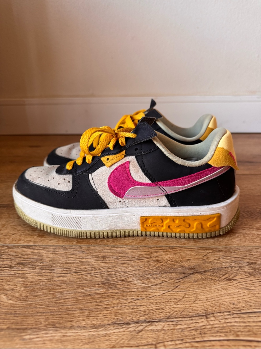 Nike Air Jordan Black and Pink Low-Top Sneakers with Yellow Accents